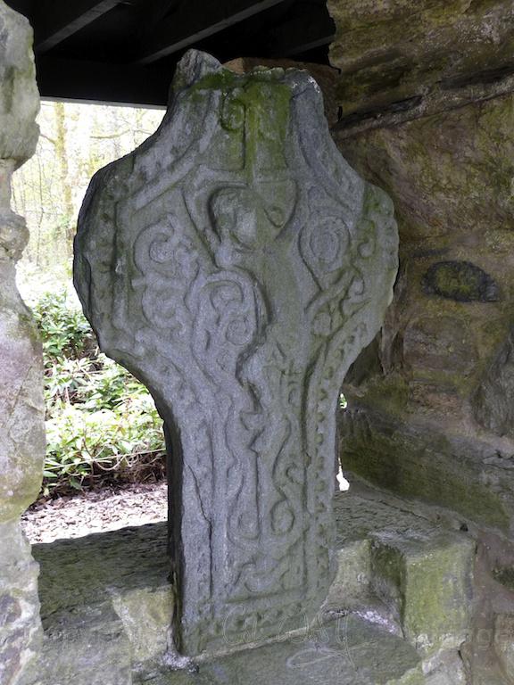 This carving of the Crucifixion was originally thought to be the broken head of the Kilberry Cross, and was stapled to the shaft, but this idea has now been disproved and the pieces have been separated.